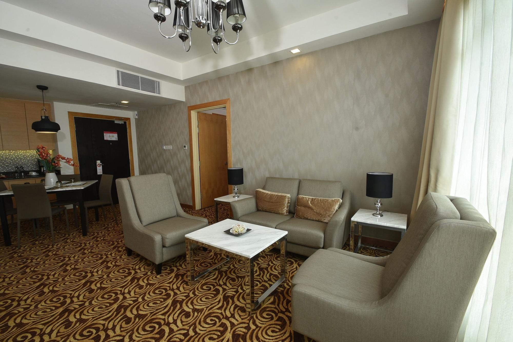 Tenera Hotel Bangi Kültér fotó A living room in a suite at the hotel